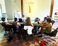 Talia Méndez (facilitator) during a workshop introducing the Media Library CAP team to creative commons licensing.