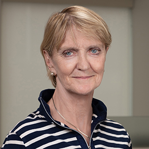 Kathy Gannon in a blue and white striped shirt